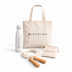 The Daily Movement Kit by GiftNYou with white water bottle, skipping rope with wooden handles, small natural-coloured drawstring pouch on a white background