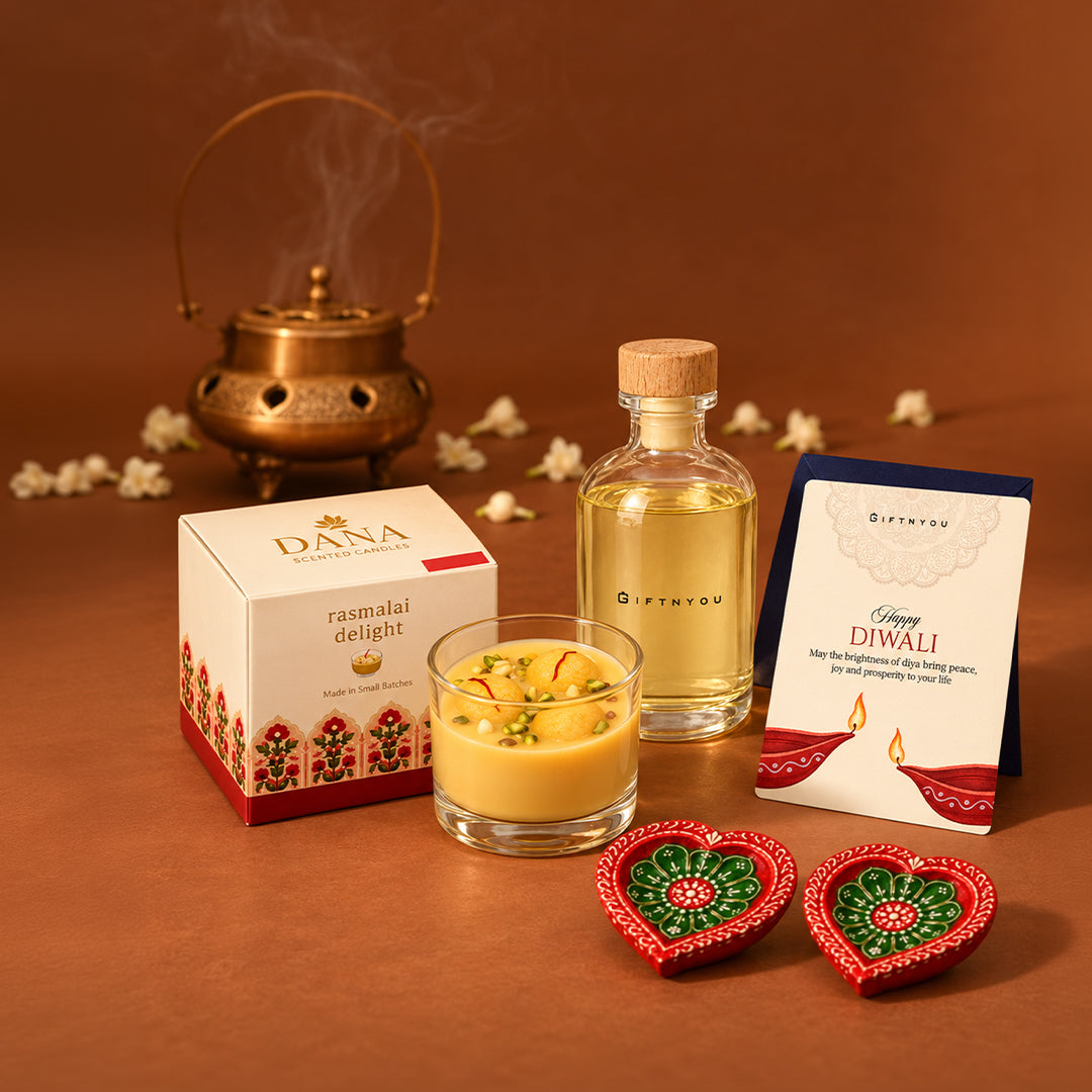 Rasmalai Delight scented candle with two heart-shaped diyas, GiftNYou bottle and Diwali greeting card