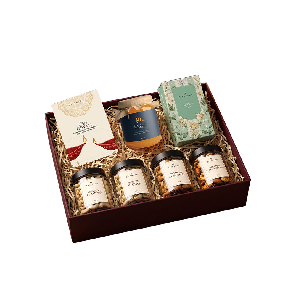 The Diwali Tea & Treats Hamper by GiftNYou on a white background