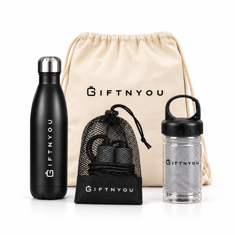 The Workout Ready Kit by GiftNYou with black water bottle, black skipping rope with mesh storage pouch, grey towel in a clear carry container on a white background