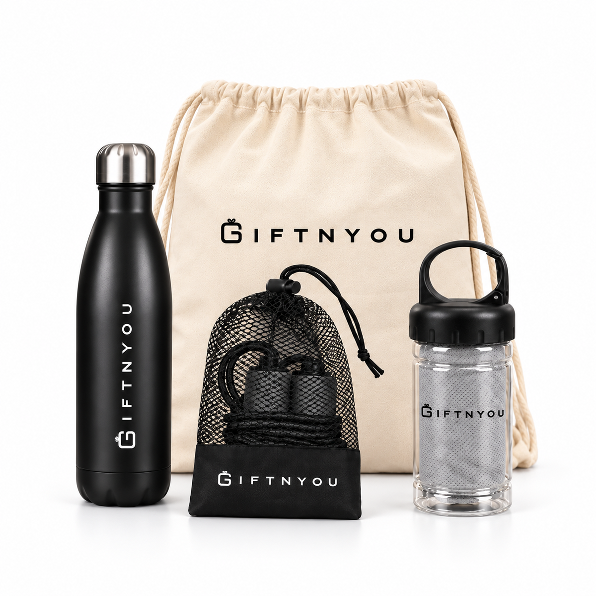 The Workout Ready Kit by GiftNYou with black water bottle, black skipping rope with mesh storage pouch, grey towel in a clear carry container on a white background