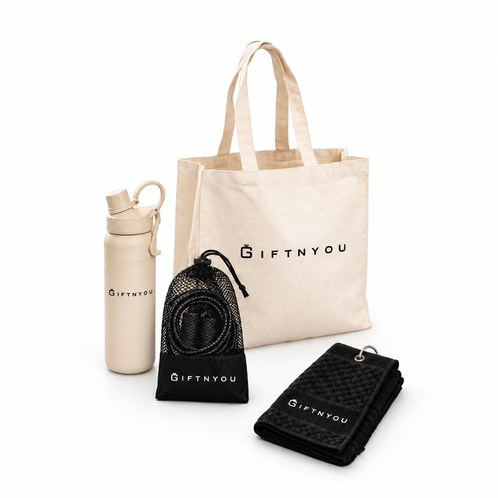 The Active Day Kit by GiftNYou with beige water bottle with carry loop, black skipping rope with mesh storage pouch, black sports towel with hanging loop on a white background