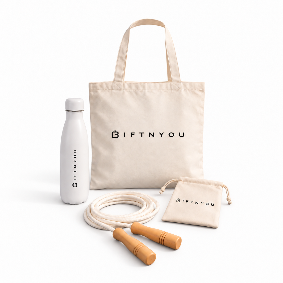 The Daily Movement Kit by GiftNYou with white water bottle, skipping rope with wooden handles, small natural-coloured drawstring pouch on a white background