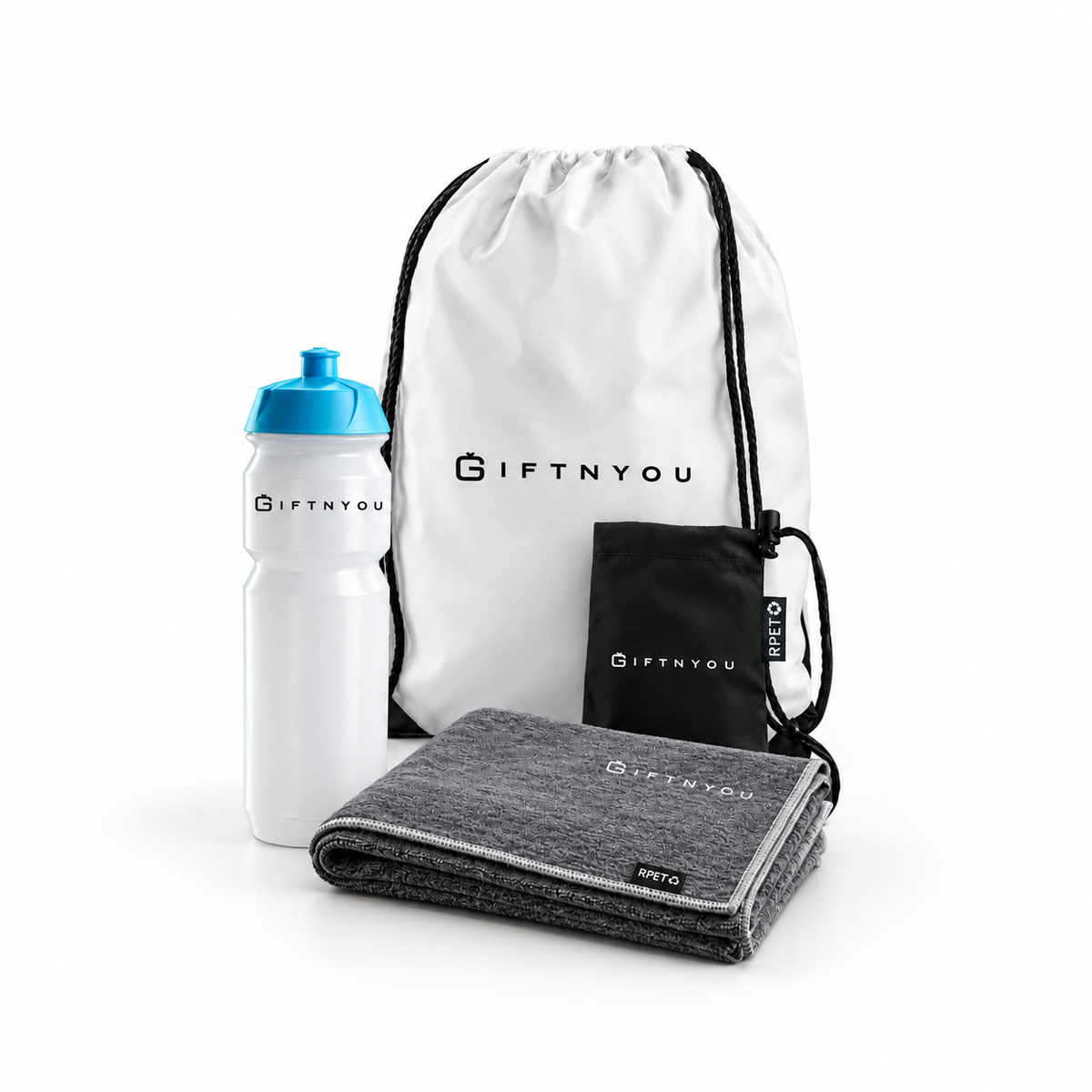 The Team Fitness Essentials Kit by GiftNYou with white sports bottle with blue cap, grey sports towel, black drawstring storage pouch on a white background